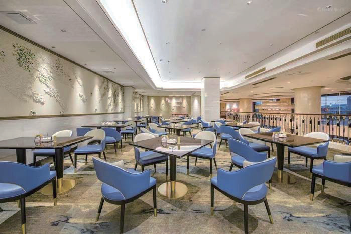 Hotel banquet hall with dining tables and commercial seating furniture