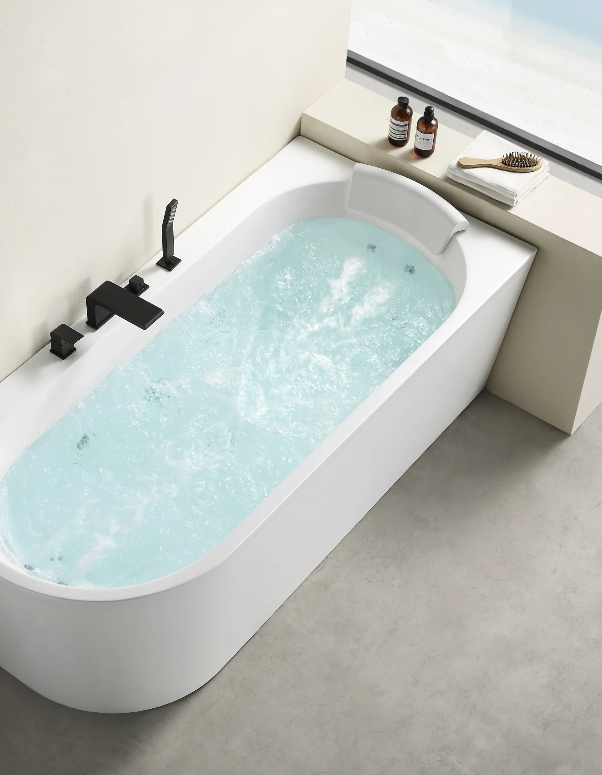 Modern bathtub with clean curved lines, integrated fixtures, and a bright contemporary bathroom setting.