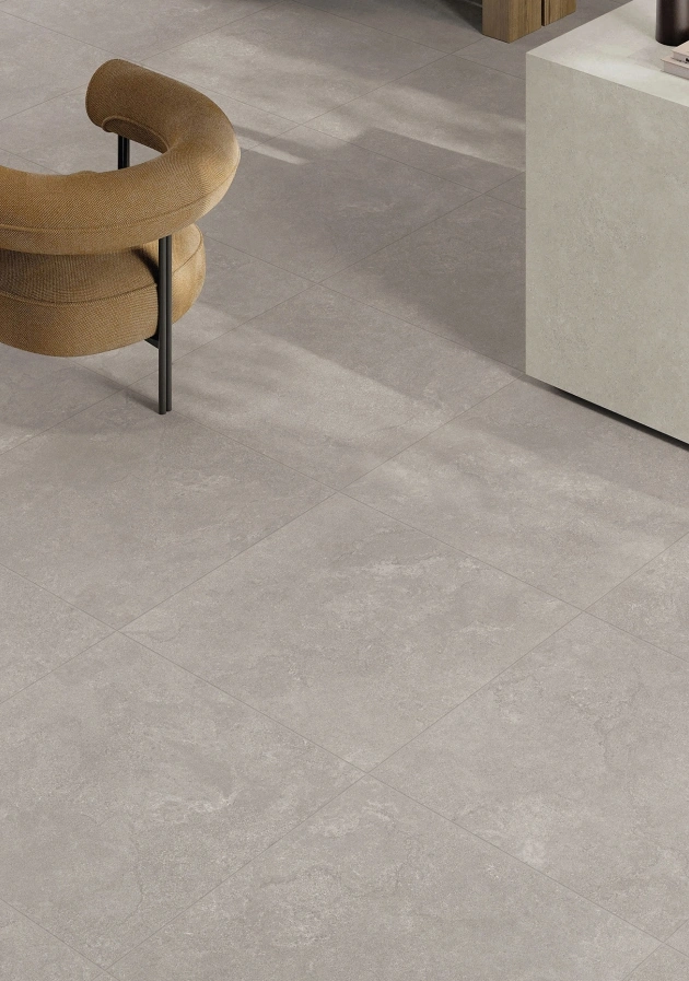 Gray antique-look floor tiles with a soft matte stone texture