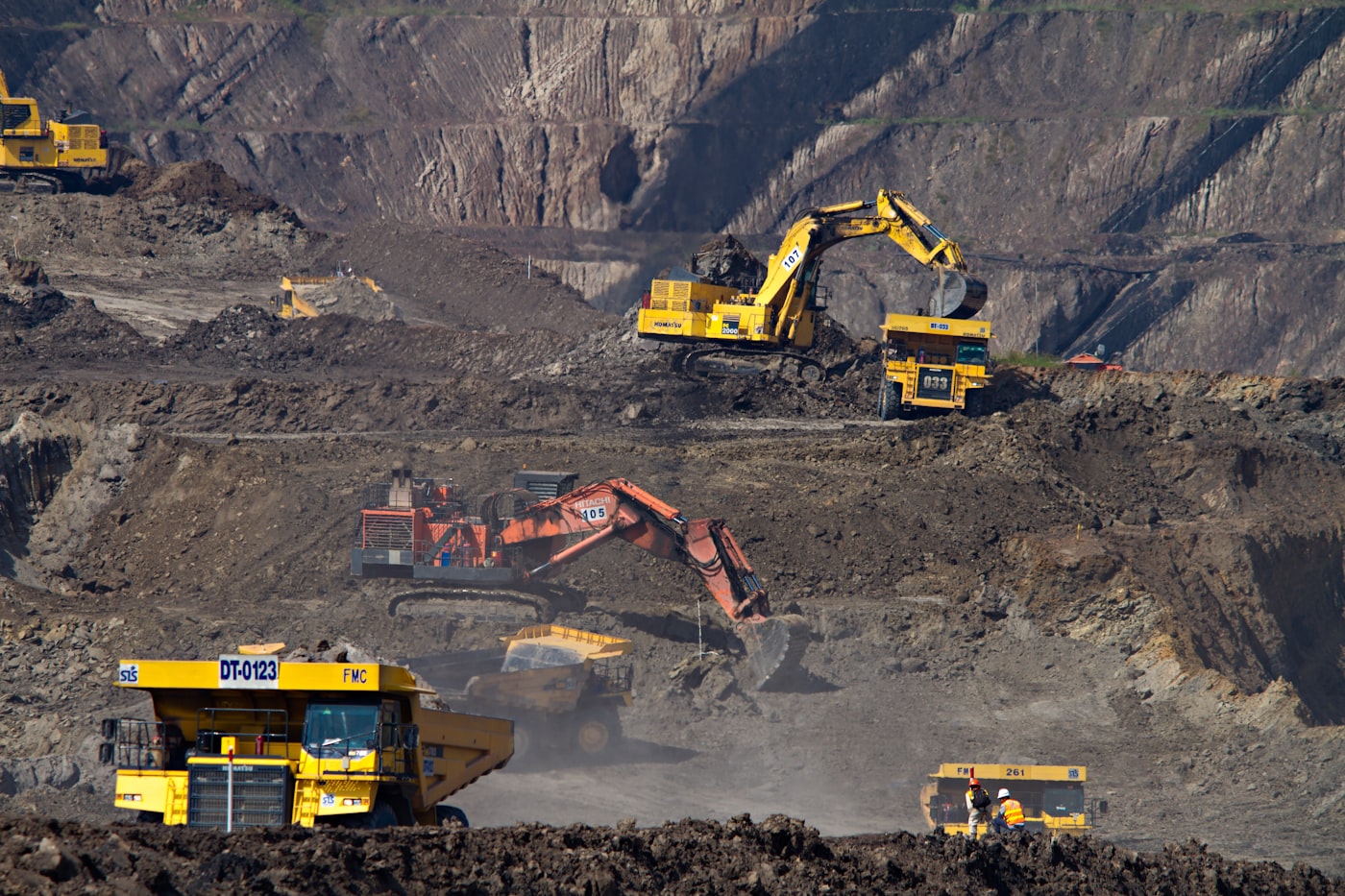 Construction and mining machinery operating at an industrial worksite