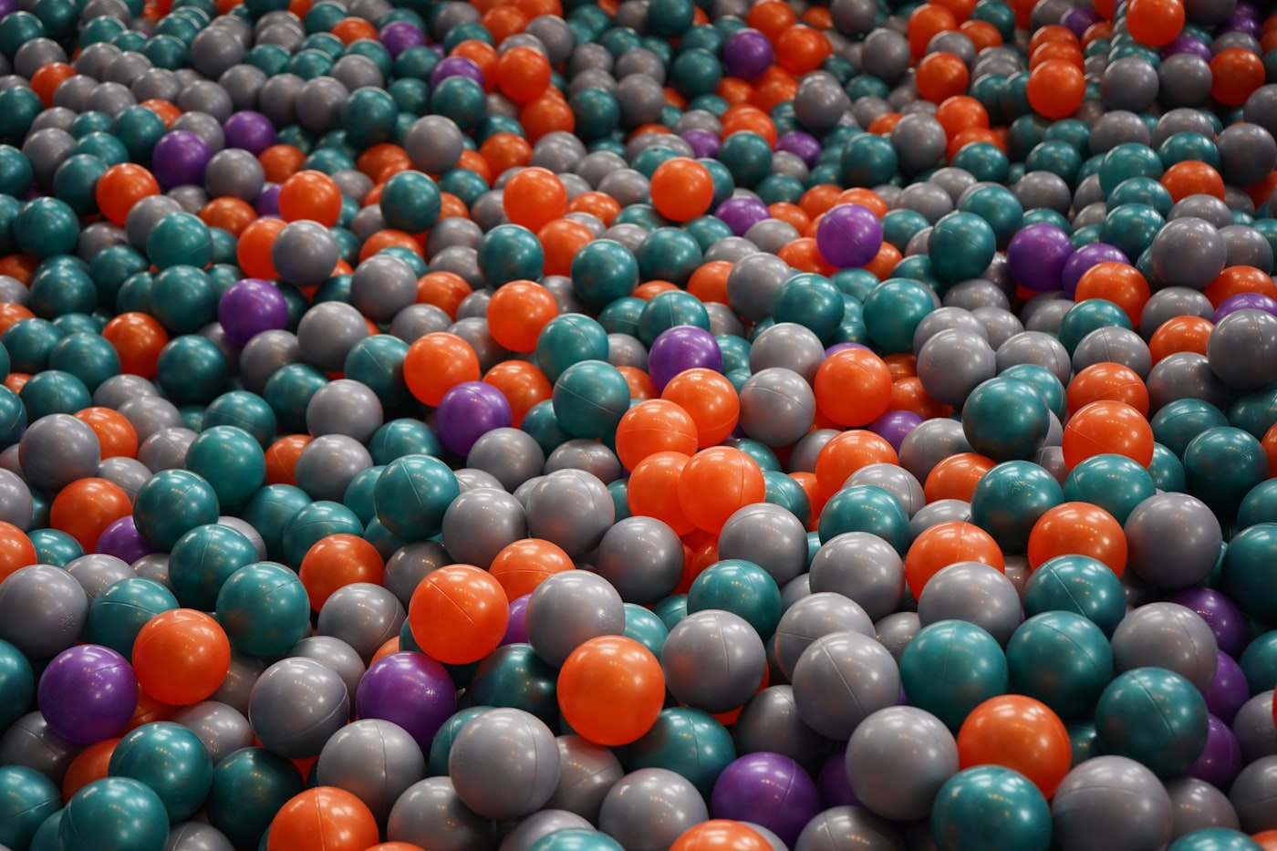 Colorful indoor playground equipment and ball pit for entertainment spaces